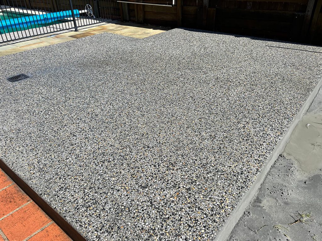 finished exposed aggregate concrete driveway